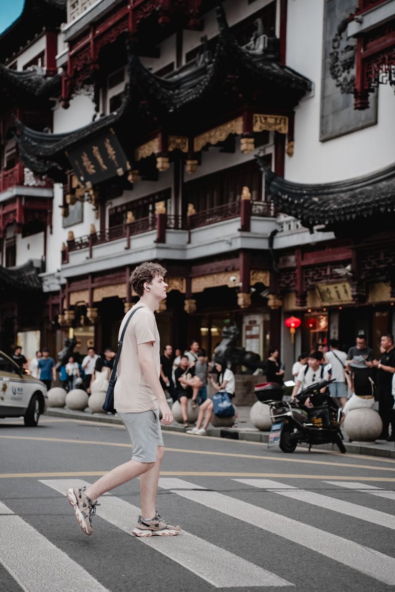 Traveler on a busy street in Shanghai