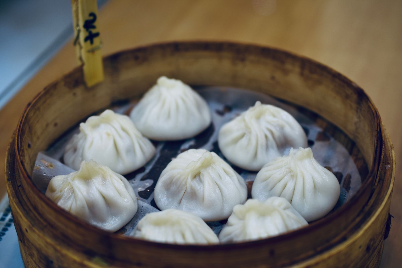 Xiao long bao served in a bamboo steamer in Shanghai
