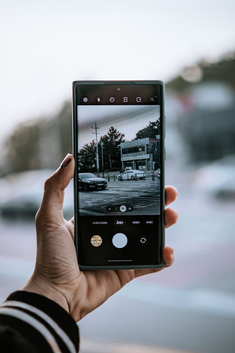 Person using a phone camera outdoors